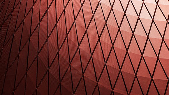 Red diamond-shaped pattern on a textured surface.