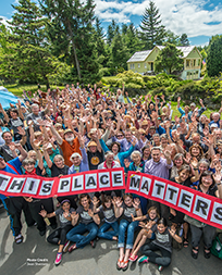 Crowd holding sign - Photo Credit: Jean Sherrard